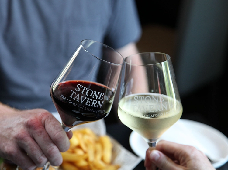 Patrons clinking glasses at Stone Tavern Phillipsburg